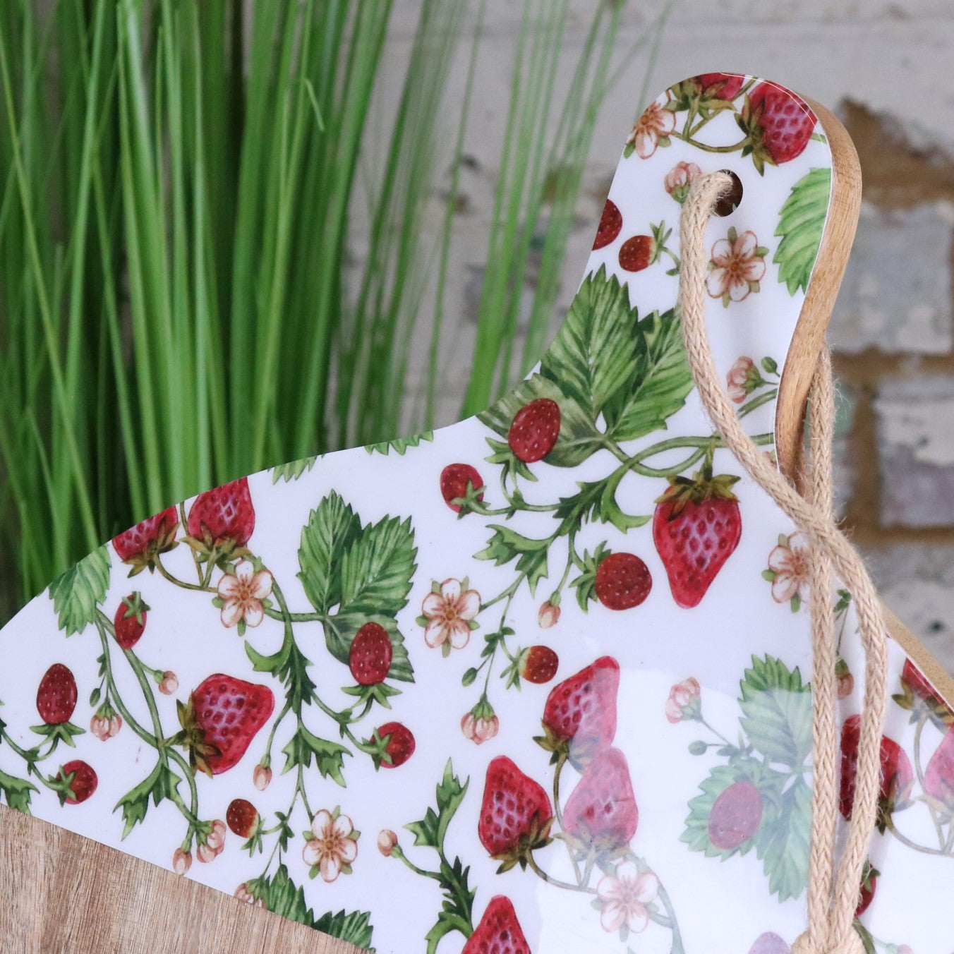Thaniya Round Chopping Board 48cm Enamel Strawberry Field Design - Closeup of Handle