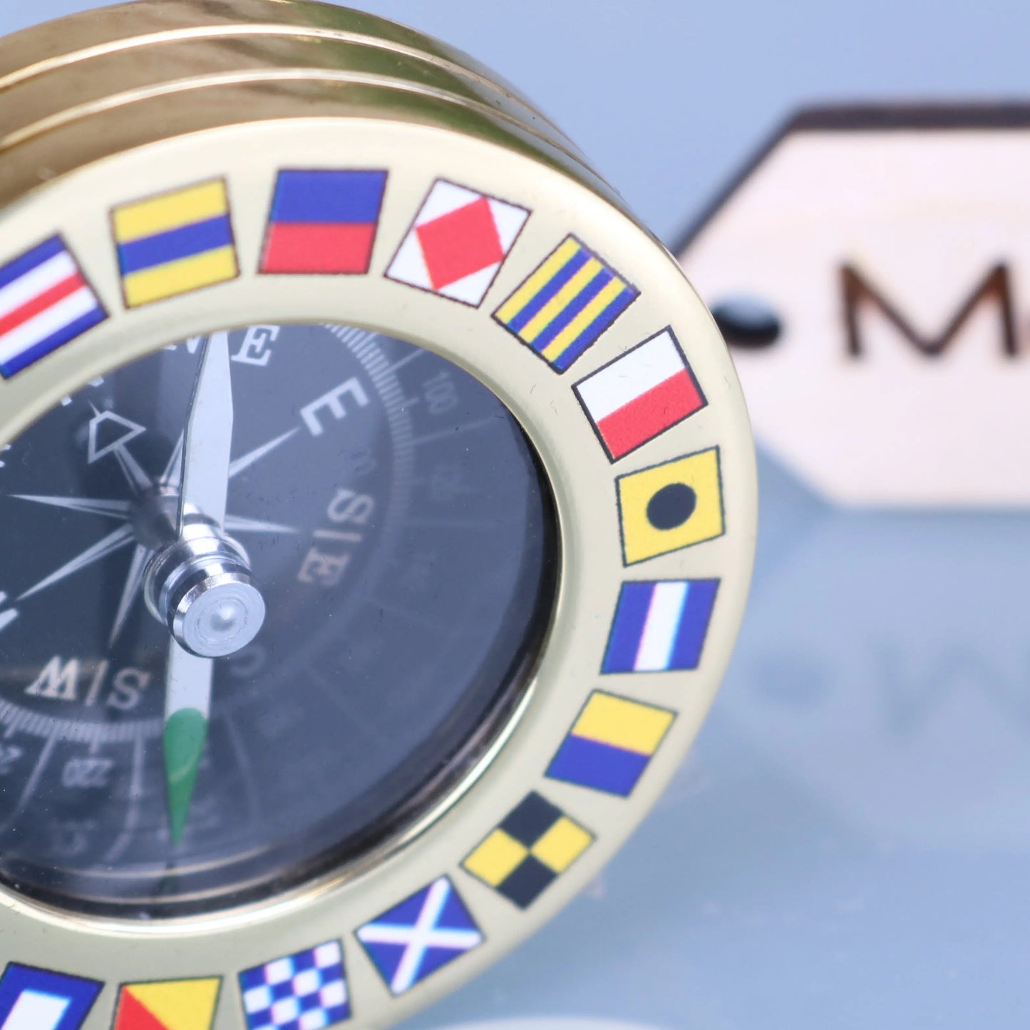 Brass Style Pocket Compass Paperweight Code Flags Closeup