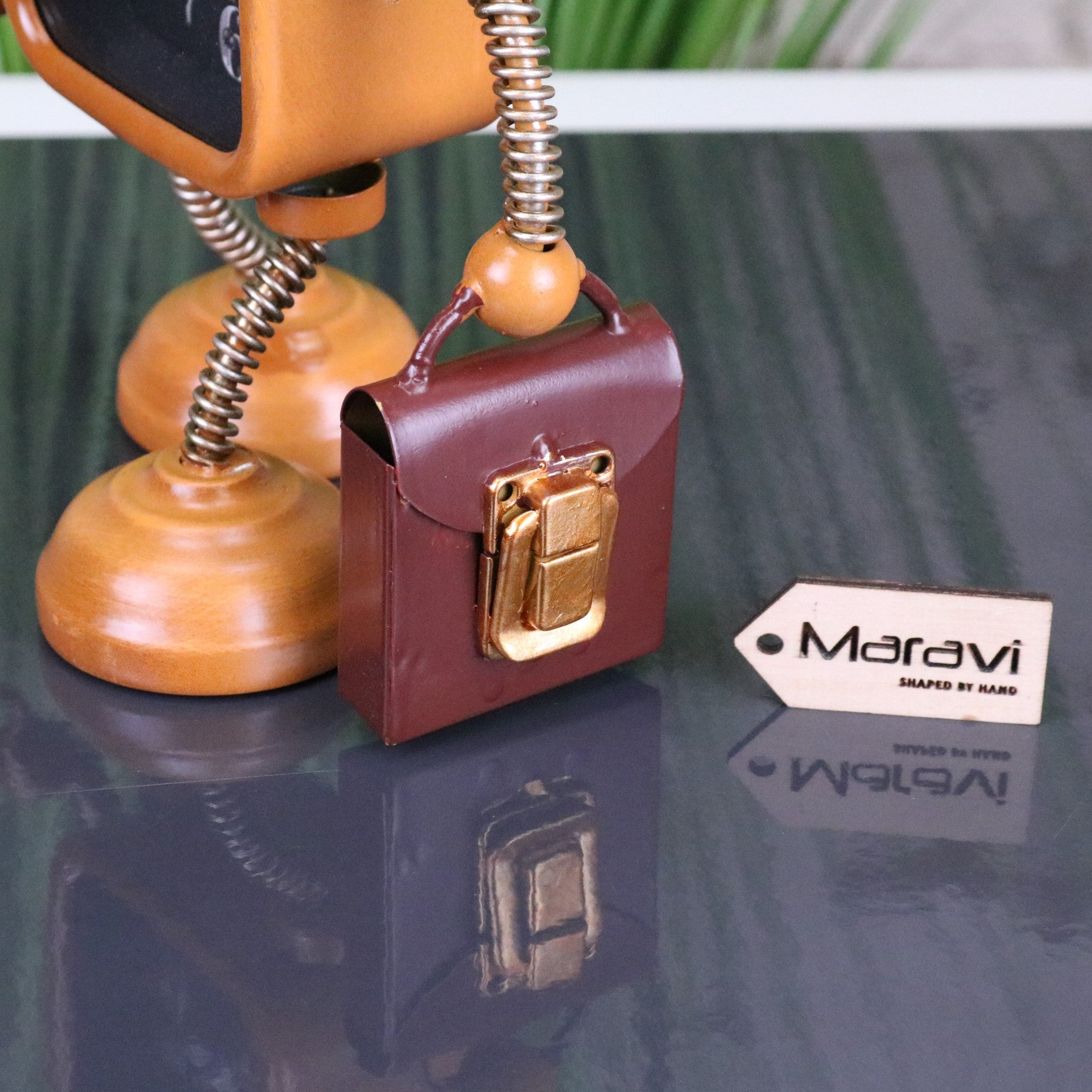 Lavira Desk Robot Clock Freestanding - Closeup of Briefcase