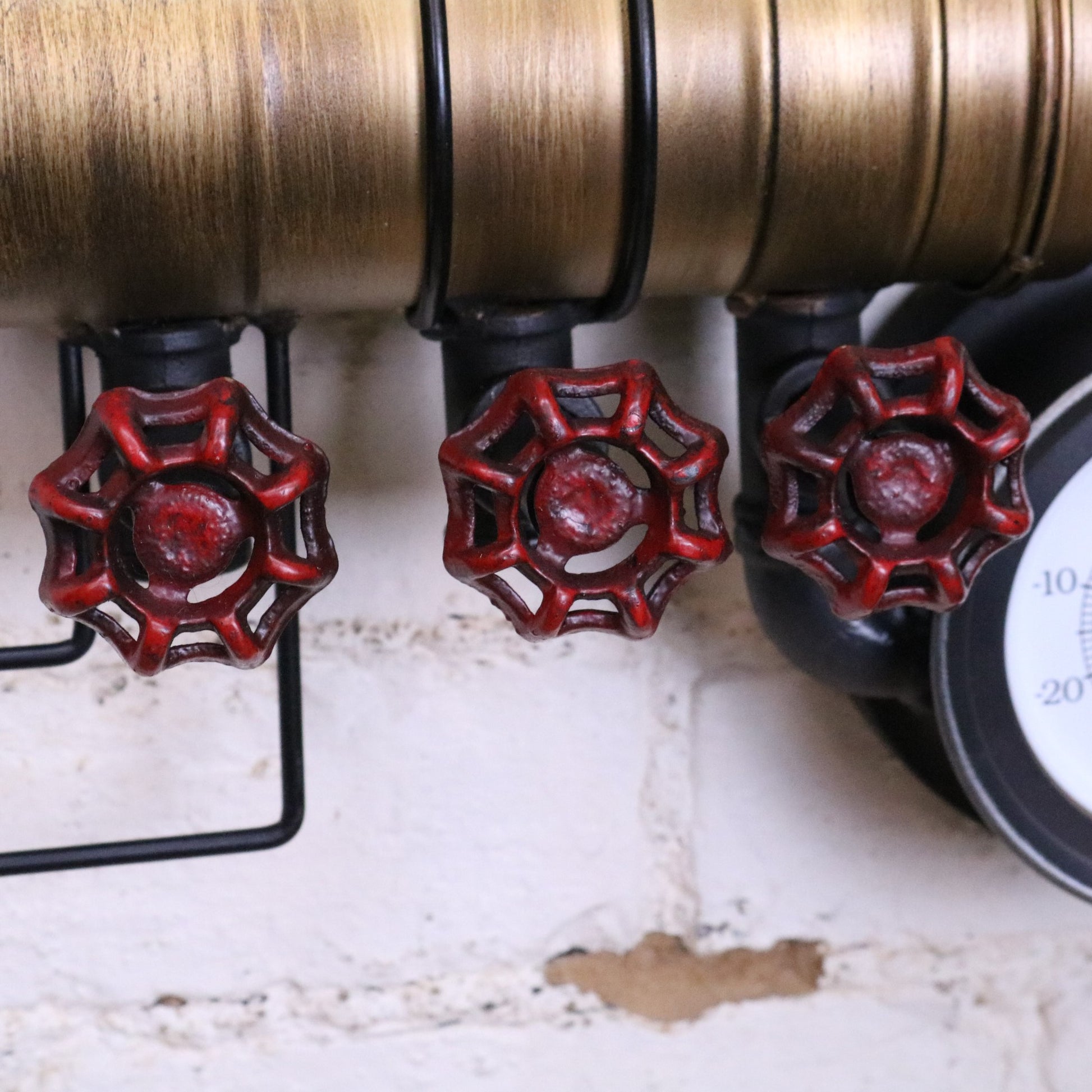 Mevara Pipe Industrial Wall Clock and Thermometer - Closeup of Red Taps
