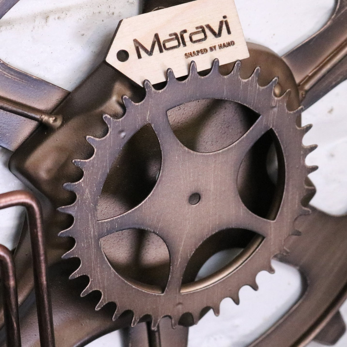 Navika Pipe Industrial Wall Clock - Closeup of Cog with Maravi Tag