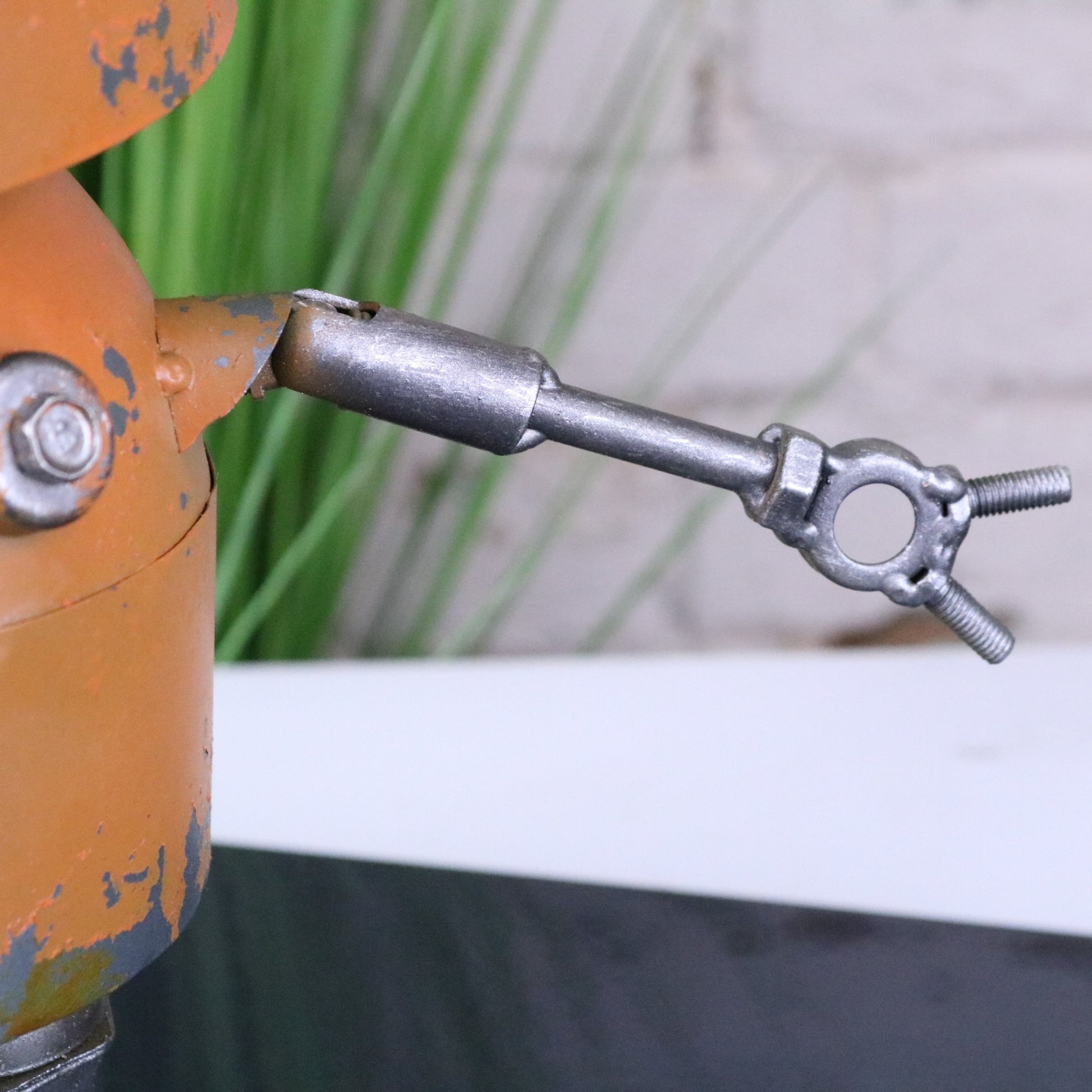 Orange Robot Ornament Springy Bobble Body - Closeup of Arm