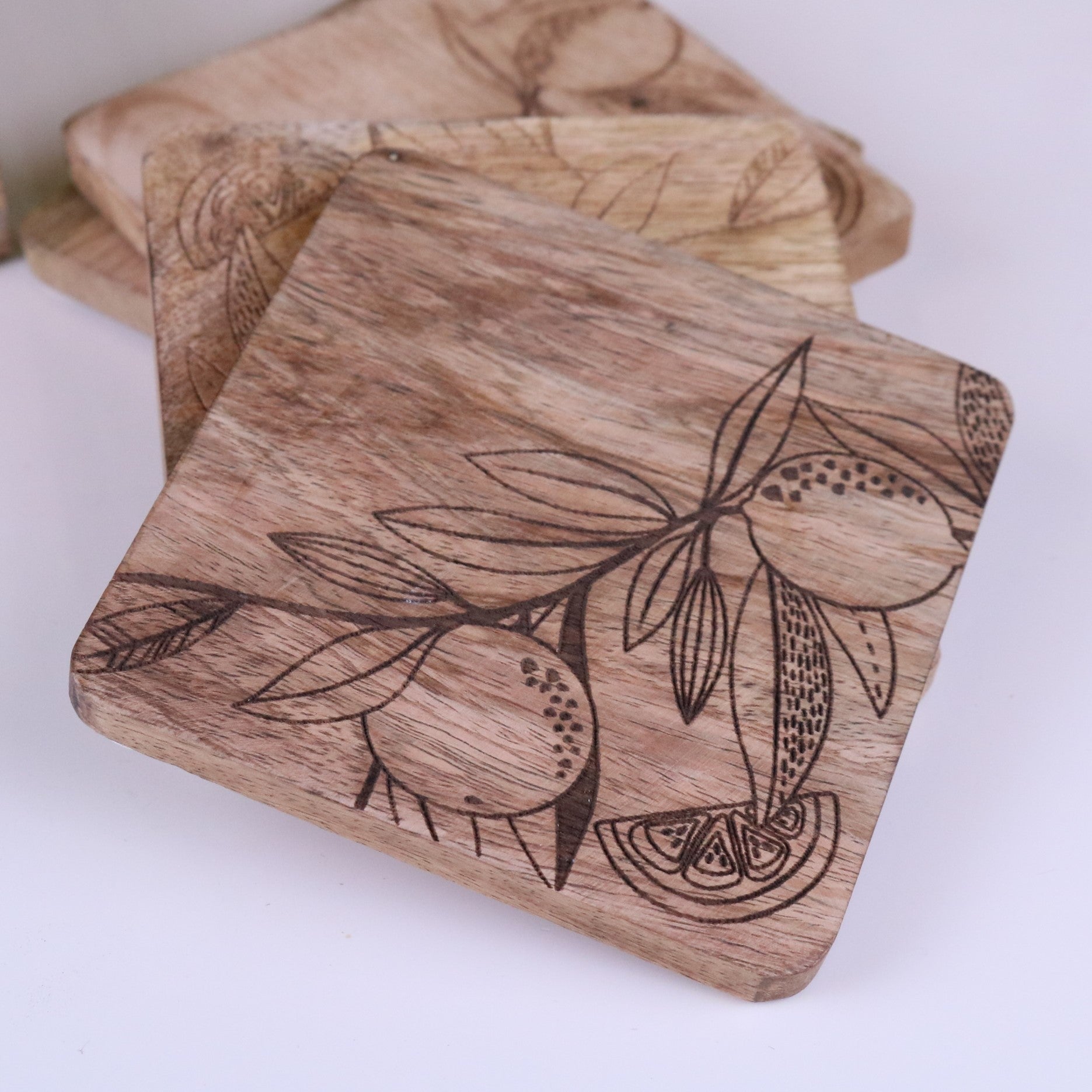 Saitras Mango Wood Coasters Engraved Citrus Design - Closeup of Single Coaster