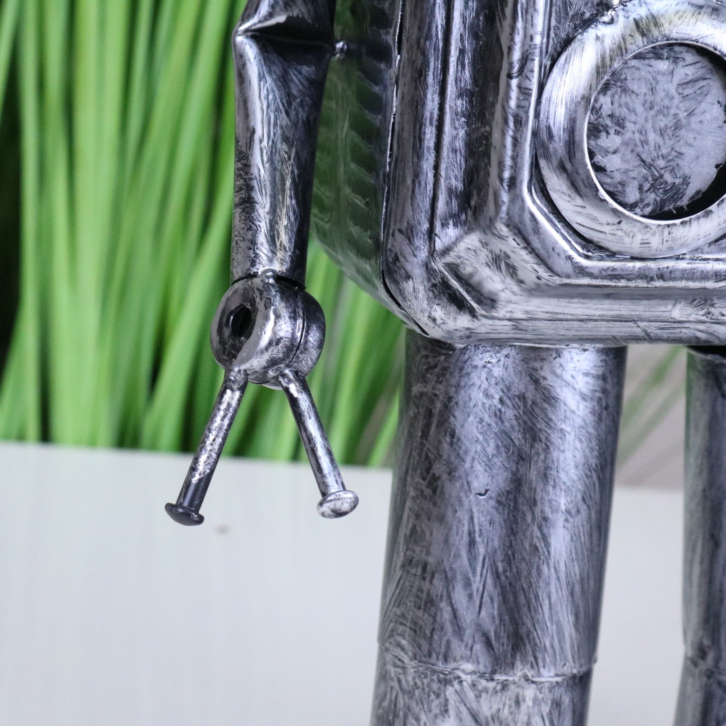 Silver Robot Ornament Springy Round Bobble Head - Closeup of Hand