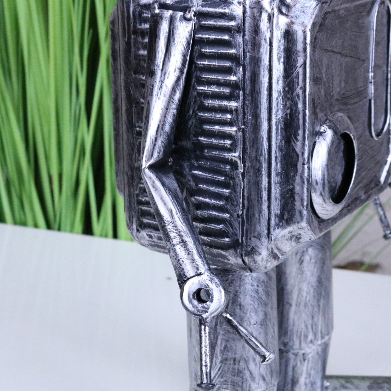 Silver Robot Ornament Springy Round Bobble Head - Closeup of Arm