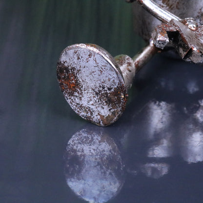Silver Siting Robot Ornament Springy Bobble Head - Closeup of Foot