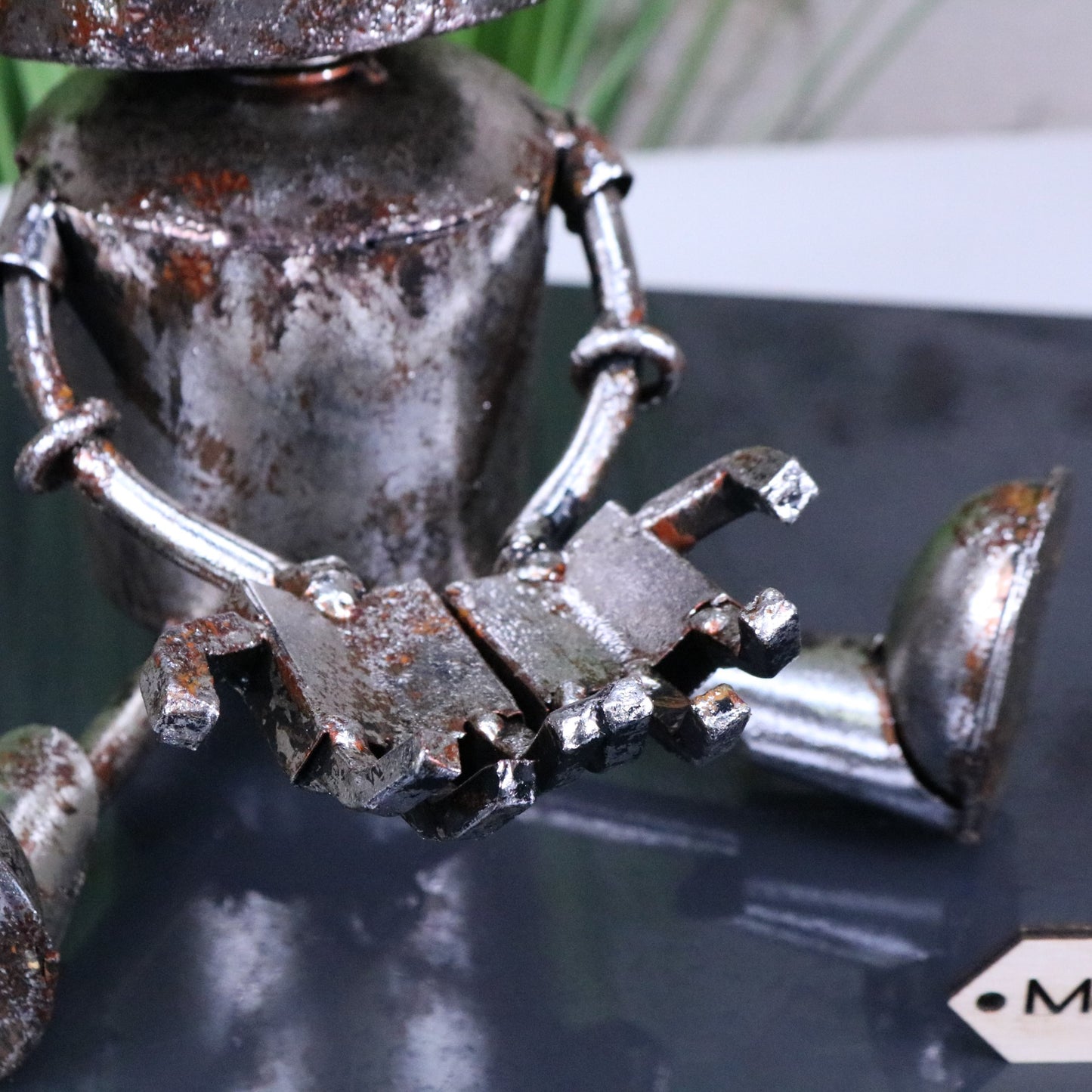 Silver Siting Robot Ornament Springy Bobble Head - Closeup of Hands