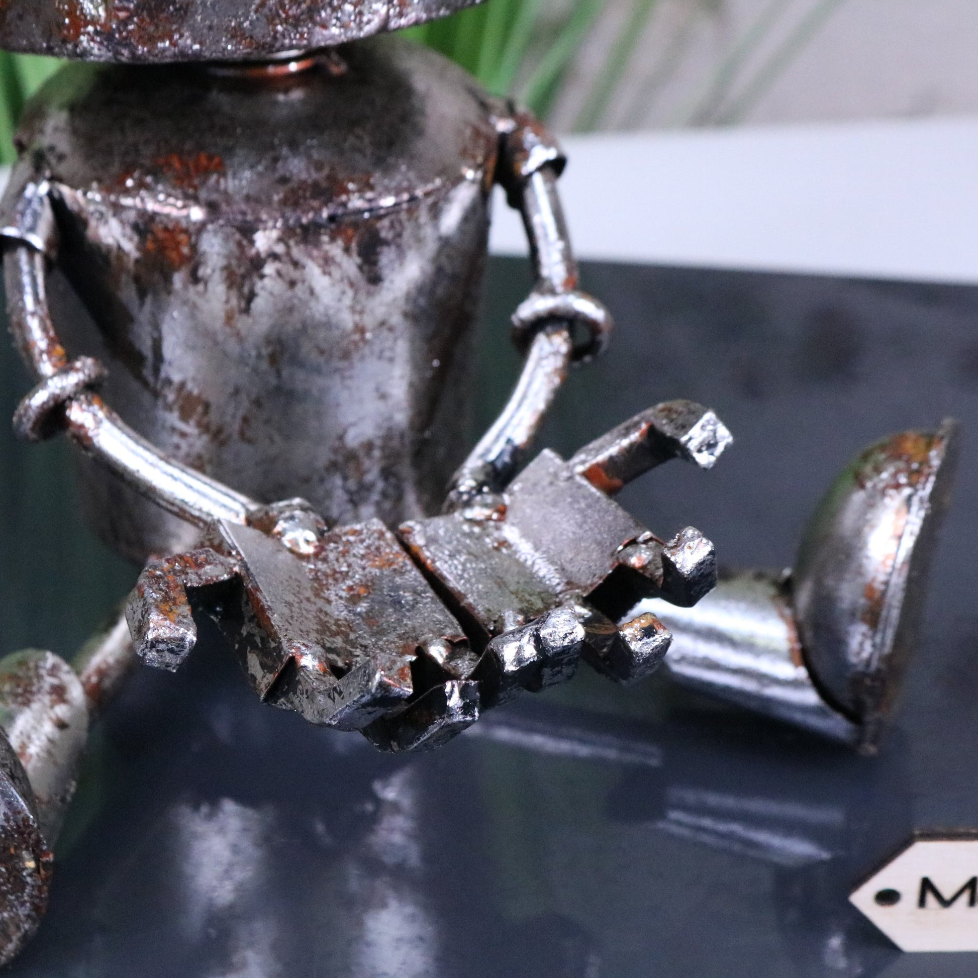 Silver Siting Robot Ornament Springy Bobble Head - Closeup of Hands