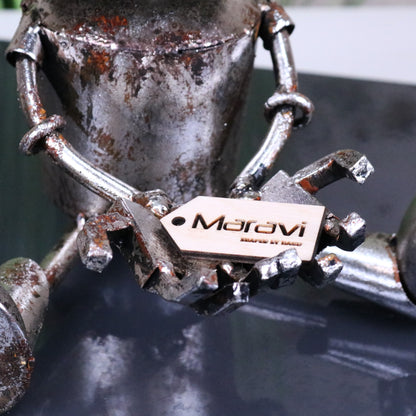 Silver Siting Robot Ornament Springy Bobble Head - Closeup of Hand Holding Tag