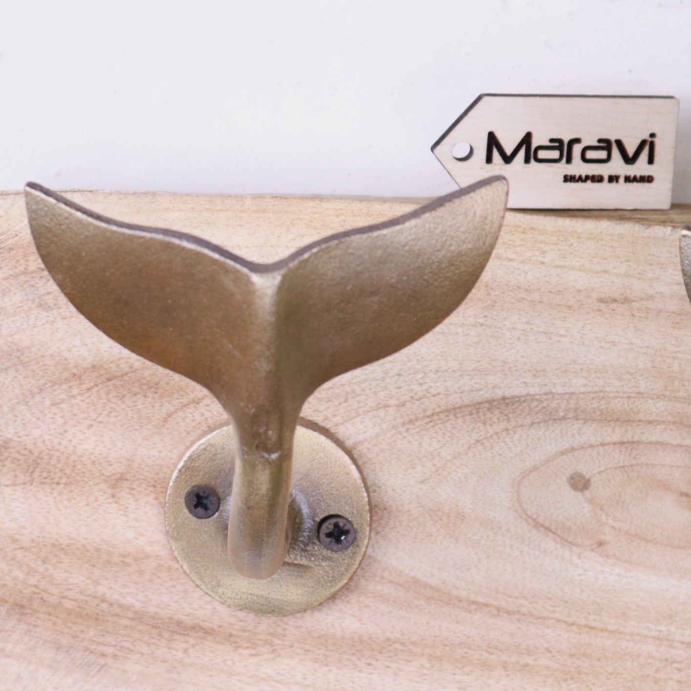 Whale Tail Hooks on Natural Wood Plank Gold - Closeup of Metal