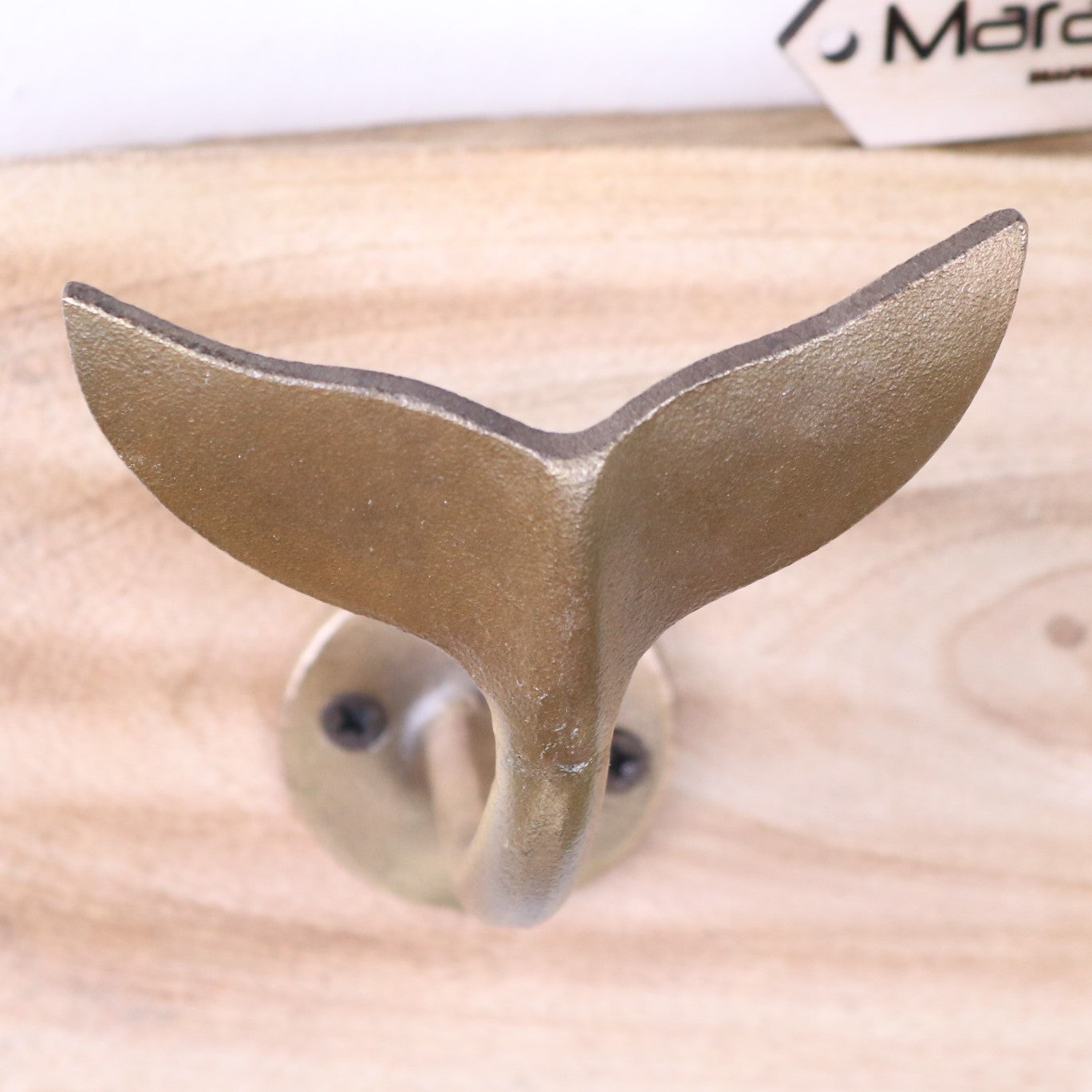 Whale Tail Hooks on Natural Wood Plank Gold - Closeup of Distressed Finish