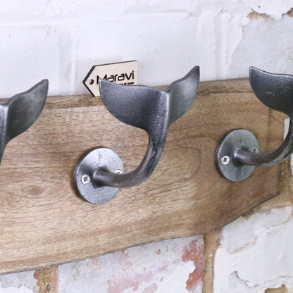 Whale Tail Hooks on Natural Wood Plank Silver - Closeup of Distressed Finish
