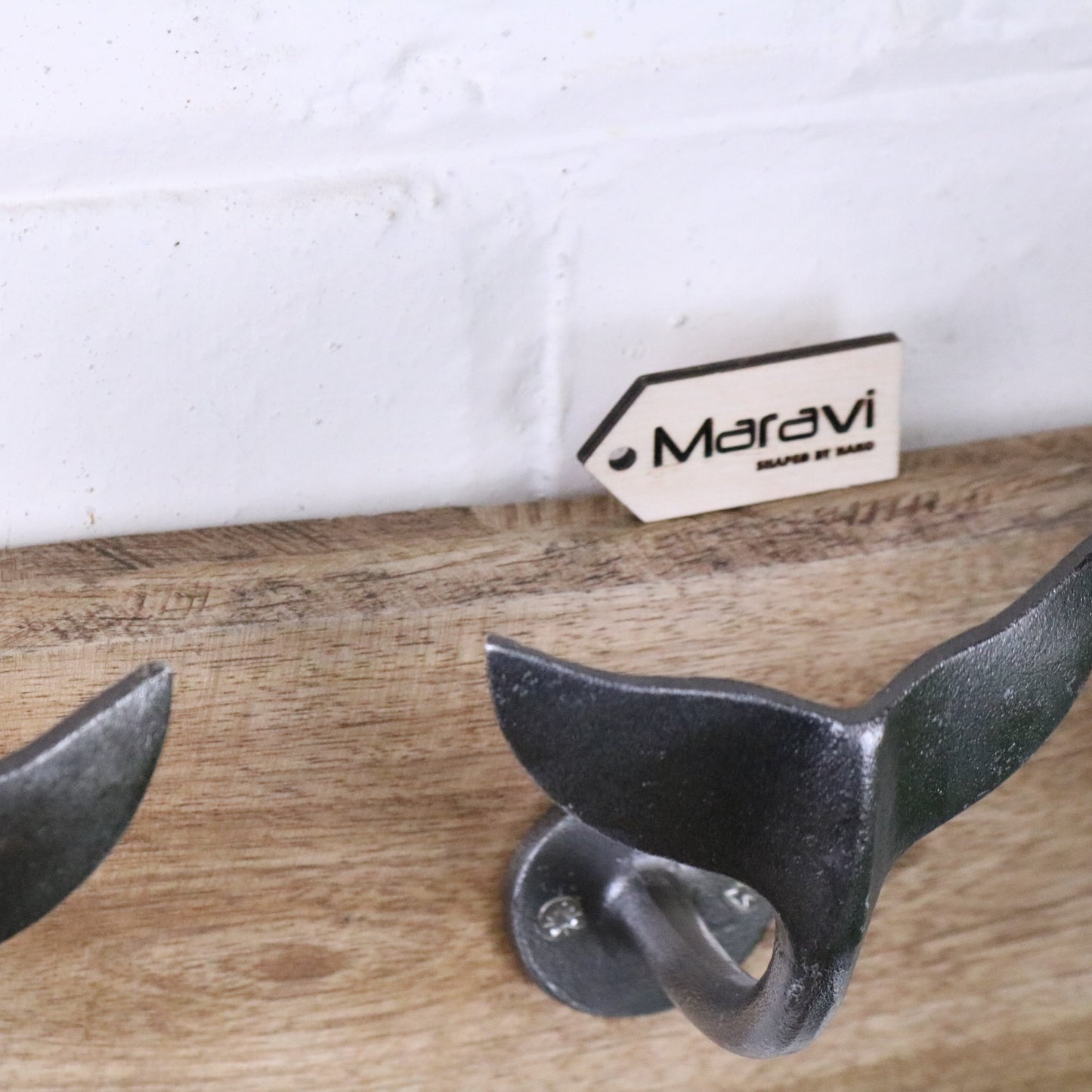 Whale Tail Hooks on Natural Wood Plank Silver - Closeup of Wood Plank