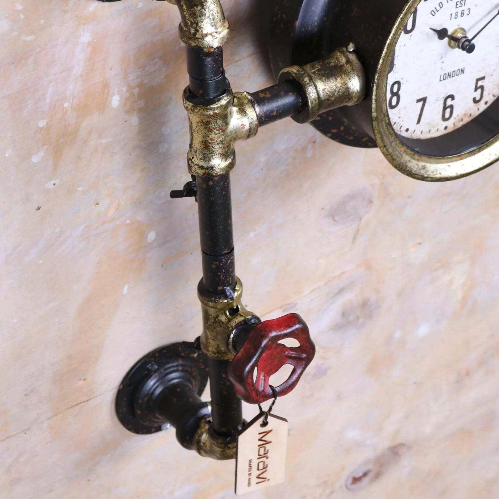 Balpur Industrial Pipe Wall Clock Black and Antique Gold Closeup of Tap