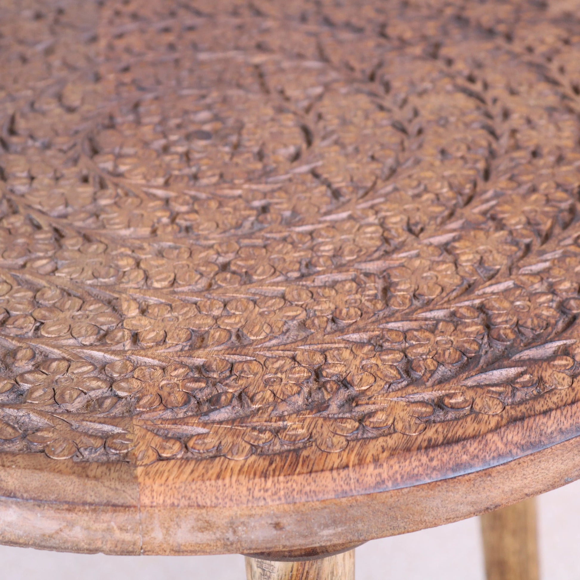 Rawlan Carved Wooden Side Table Burnt Finish Closeup of Carving