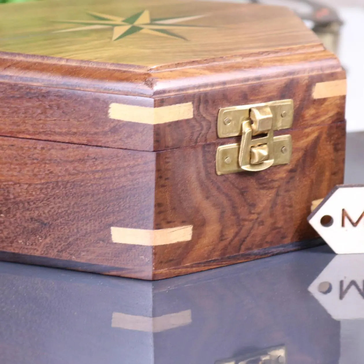 Araria Hexagonal Wooden Box with Compass Inlay Closeup of Brass Catch