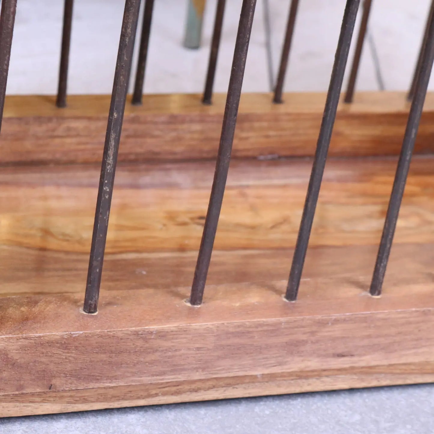 Solid Mango Wood Magazine Rack with Iron Bar Detailing - Closeup of Iron Bars
