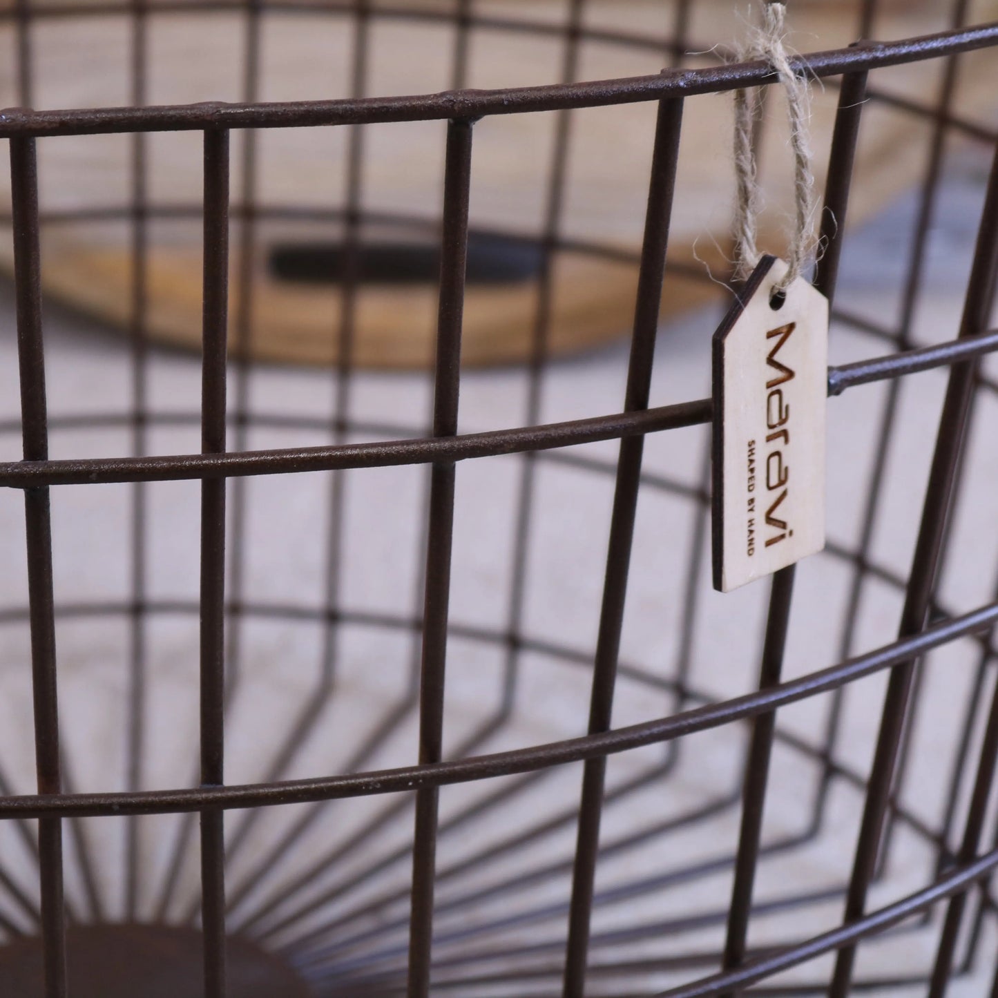 Tilpi Basket Table With Wood Lid - Closeup of Industrial Metal Grid