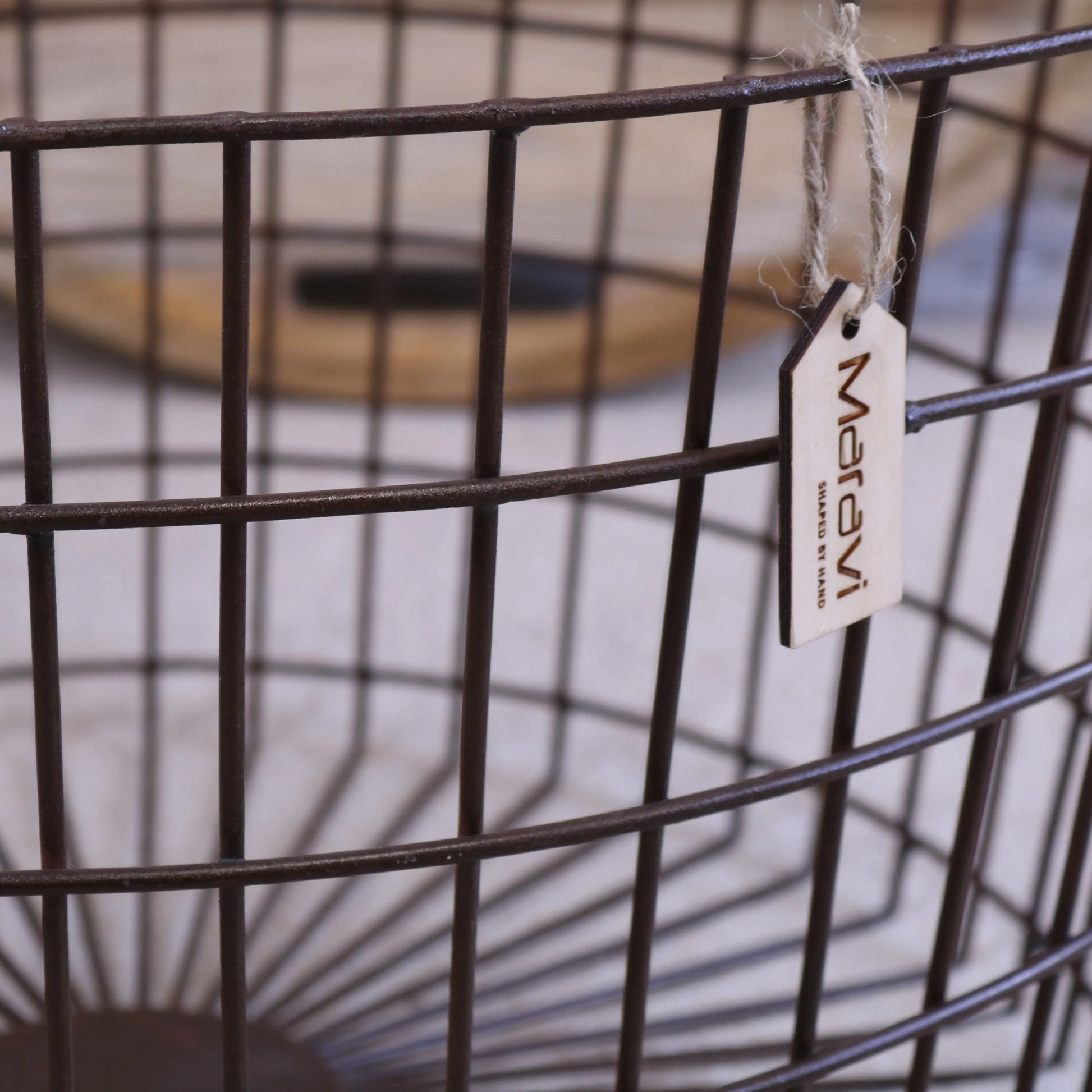 Tilpi Basket Table With Wood Lid - Closeup of Industrial Metal Grid